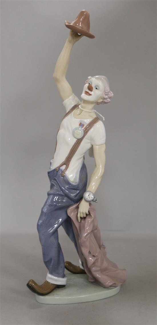 A Lladro clown with jacket hat wearing a watch
